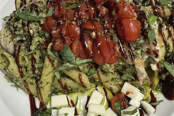 Salad with cherry tomatoes, fresh mozzarella and balsamic glaze